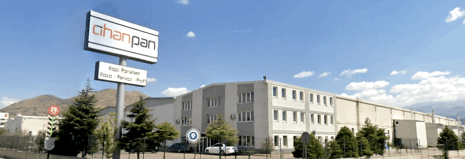 Exterior view of the Cihanpan Door factory, showcasing its large-scale production facility for wholesale interior wooden doors and internal door exports.